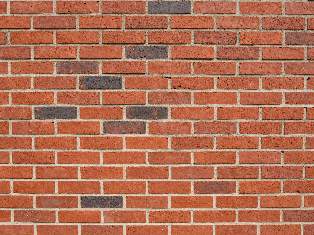 Close-up of freshly laid red brick wall with clean mortar joints,
