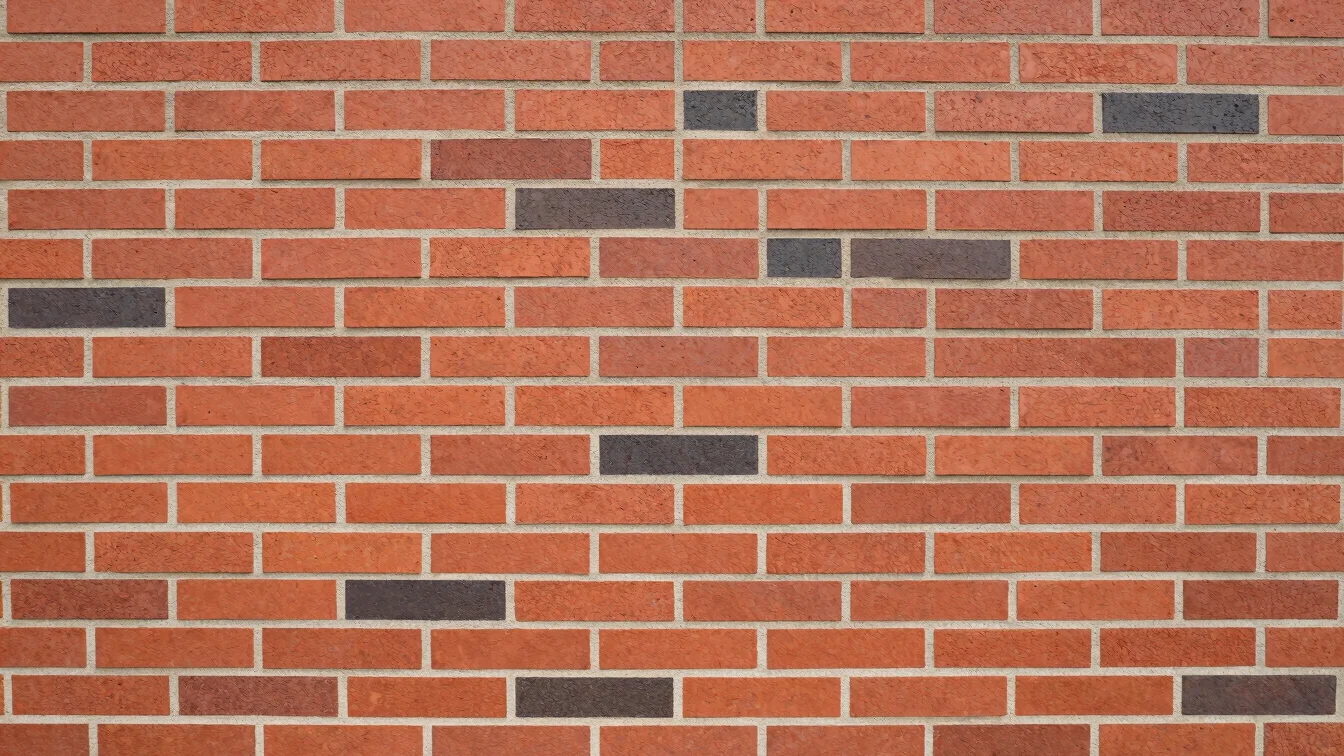 Detail shot of freshly laid red brick wall with clean, sharp mort